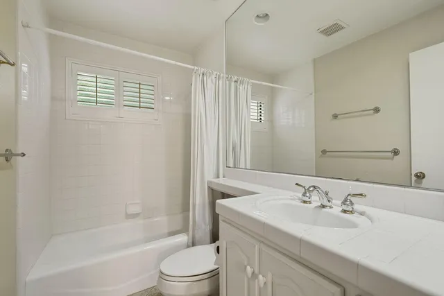 a bathroom with a sink and cabinets