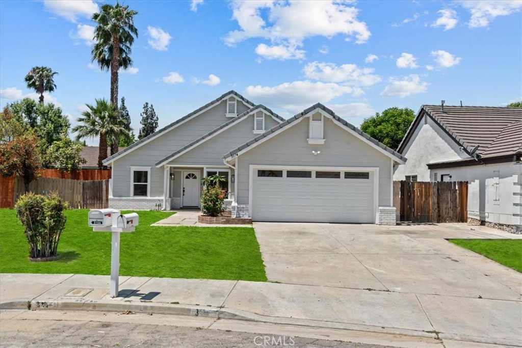 3176 Landmark Court Riverside, CA 92503 - Photo 1 of 1 a front view of a house with a yard and garage