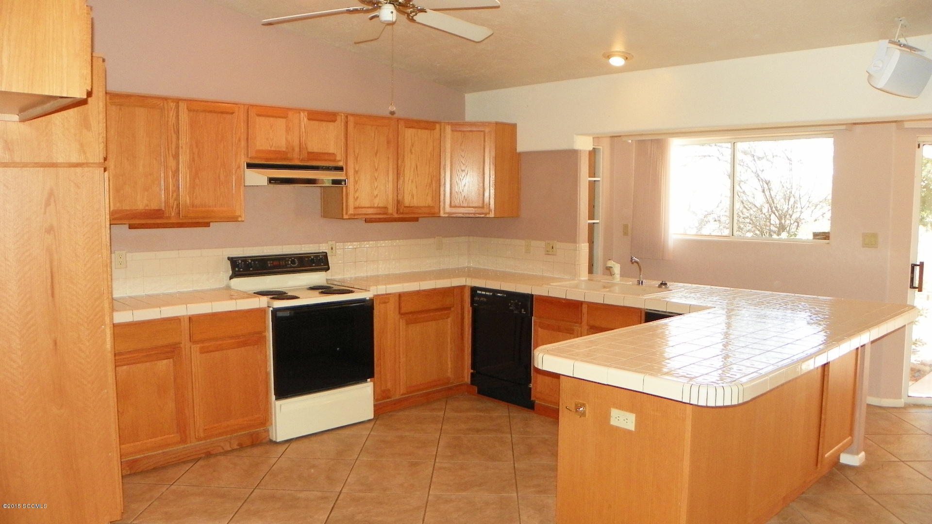 134 Ruta Camaron Rio Rico, AZ 85648 - Photo 3 of 25 a kitchen with stainless steel appliances granite countertop a sink stove and refrigerator