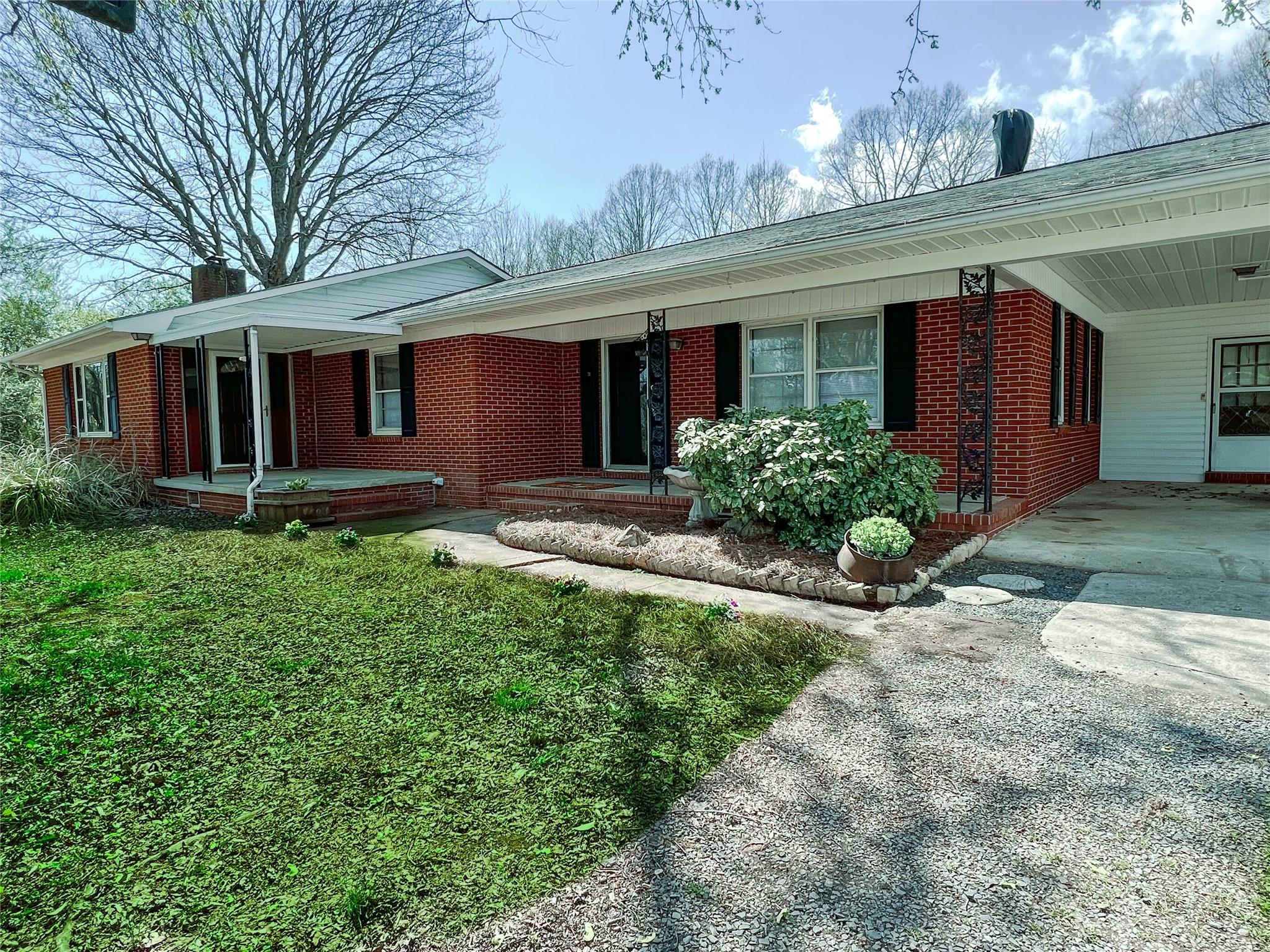 200 Johnson Dairy Road Rockwell, NC 28138 - Photo 1 of 36 a front view of a house with garden