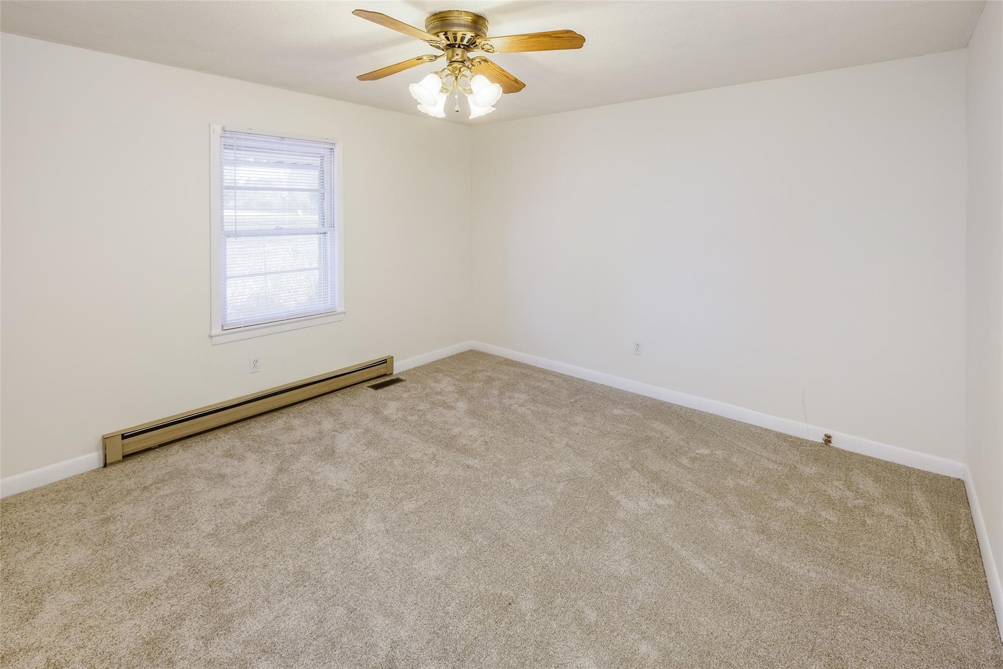 200 Johnson Dairy Road Rockwell, NC 28138 - Photo 11 of 36 an empty room with windows and fan