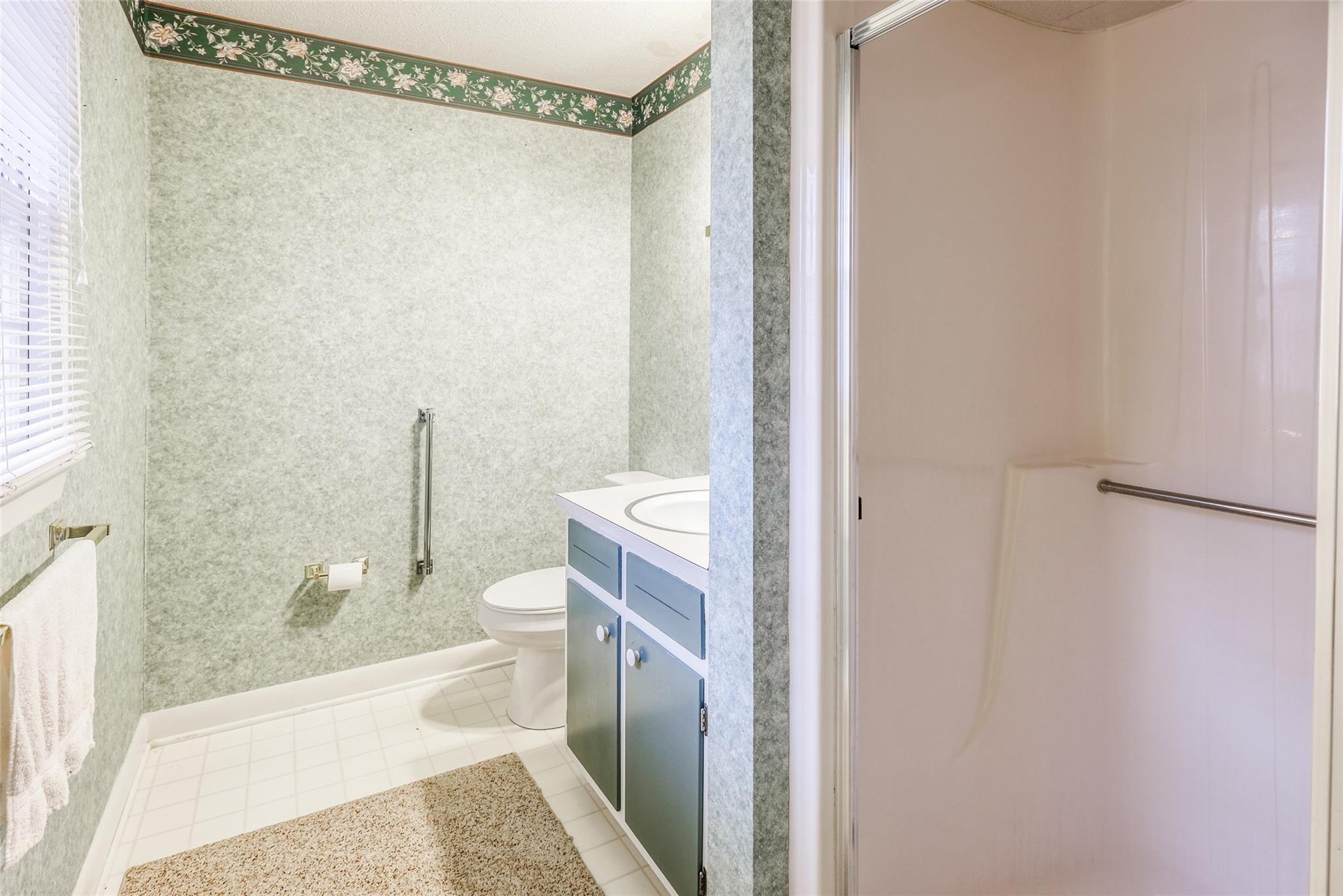 200 Johnson Dairy Road Rockwell, NC 28138 - Photo 16 of 36 a bathroom with a sink a toilet and shower