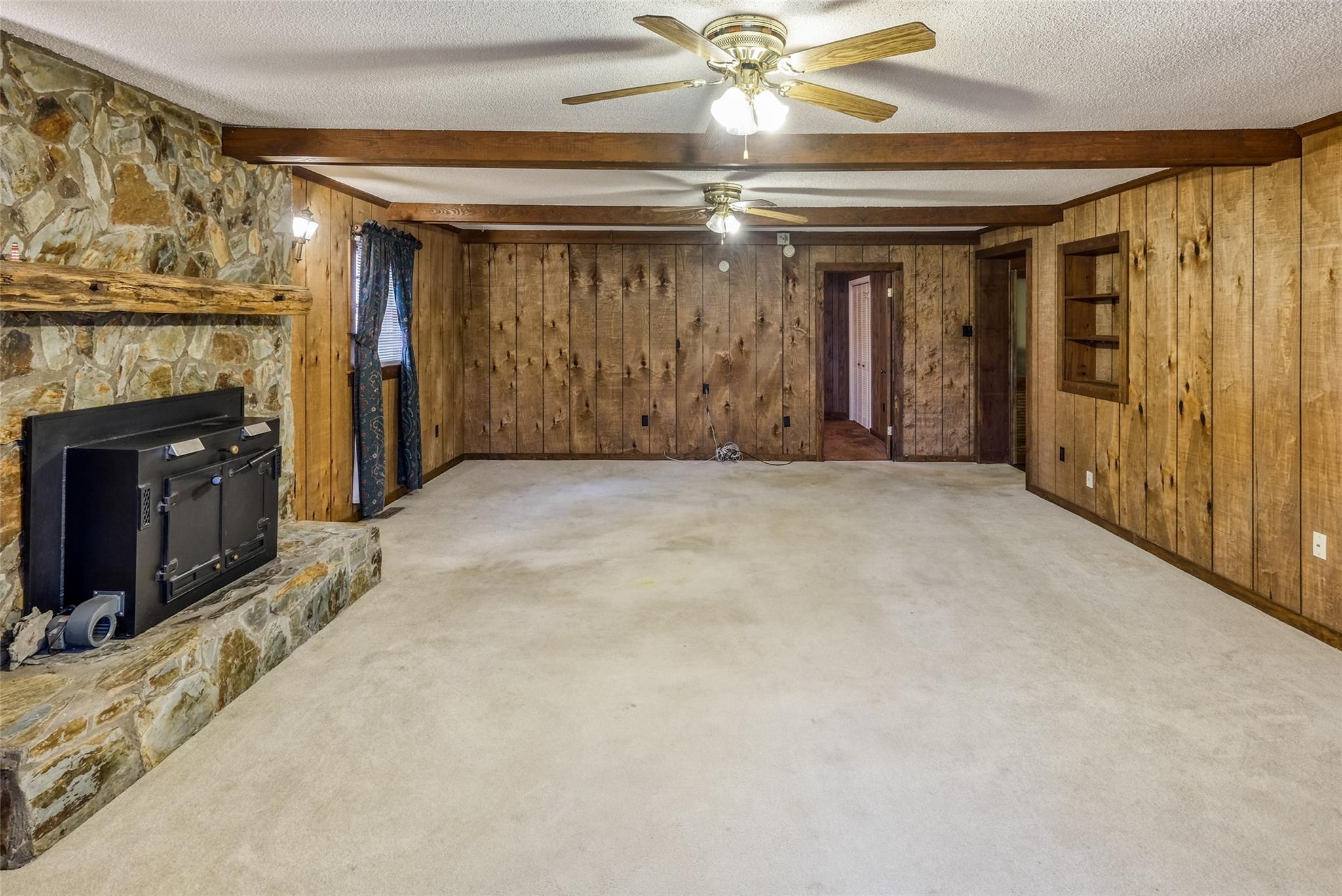 200 Johnson Dairy Road Rockwell, NC 28138 - Photo 18 of 36 wooden floor in an empty room with a fireplace