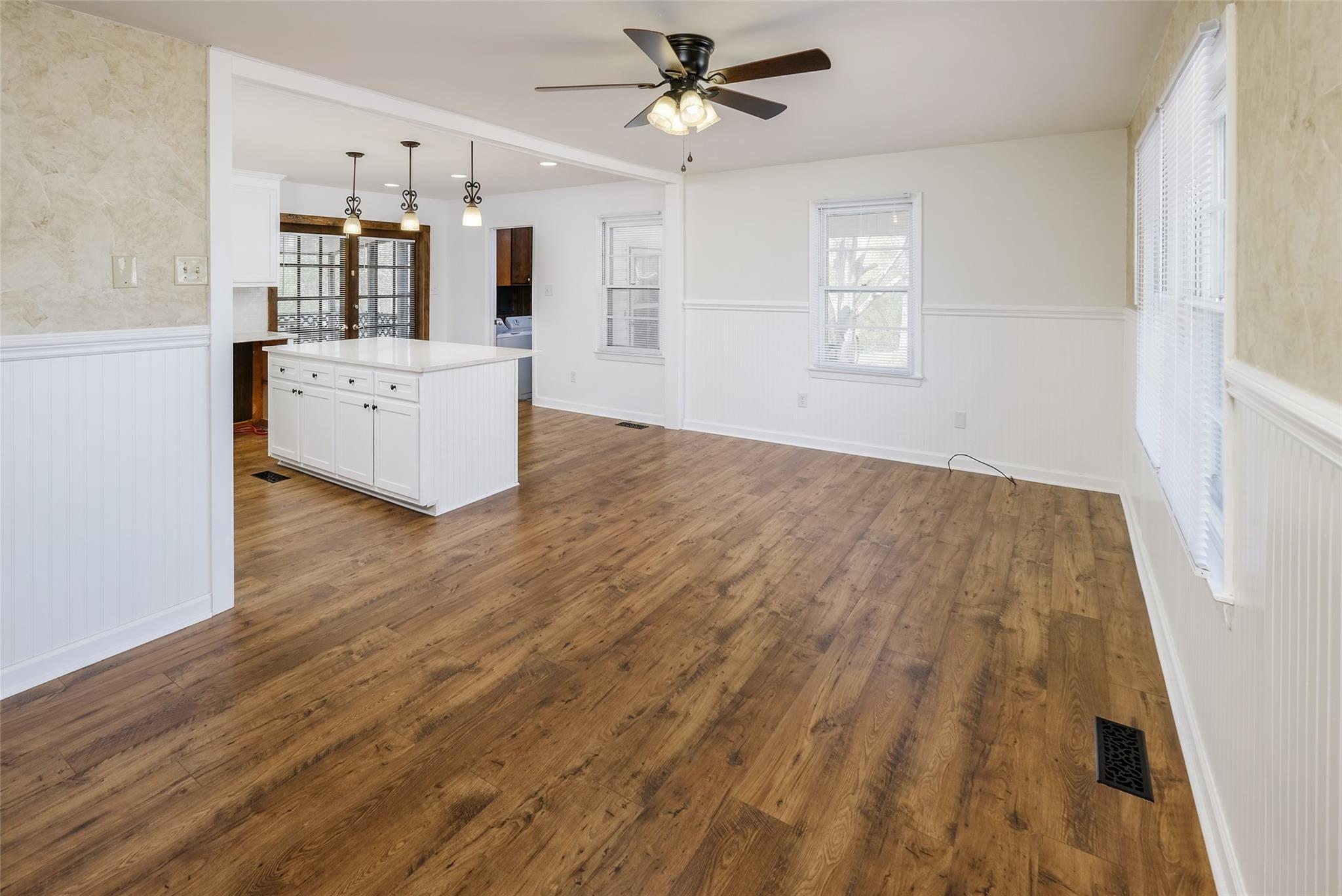 200 Johnson Dairy Road Rockwell, NC 28138 - Photo 3 of 36 a view of a kitchen with a sink dishwasher a kitchen view with wooden floor and cabinets