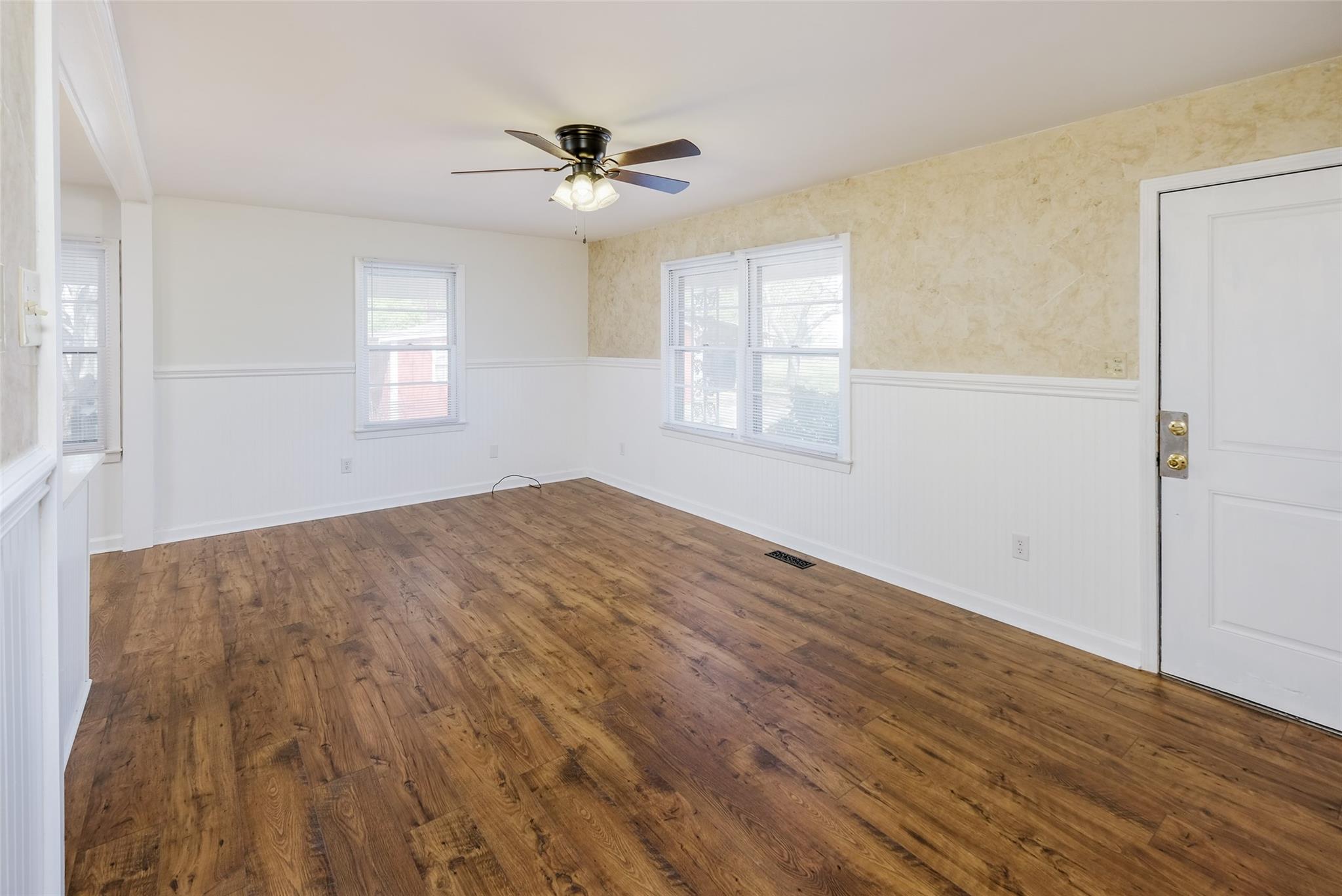 200 Johnson Dairy Road Rockwell, NC 28138 - Photo 4 of 36 a view of empty room with wooden floor and fan