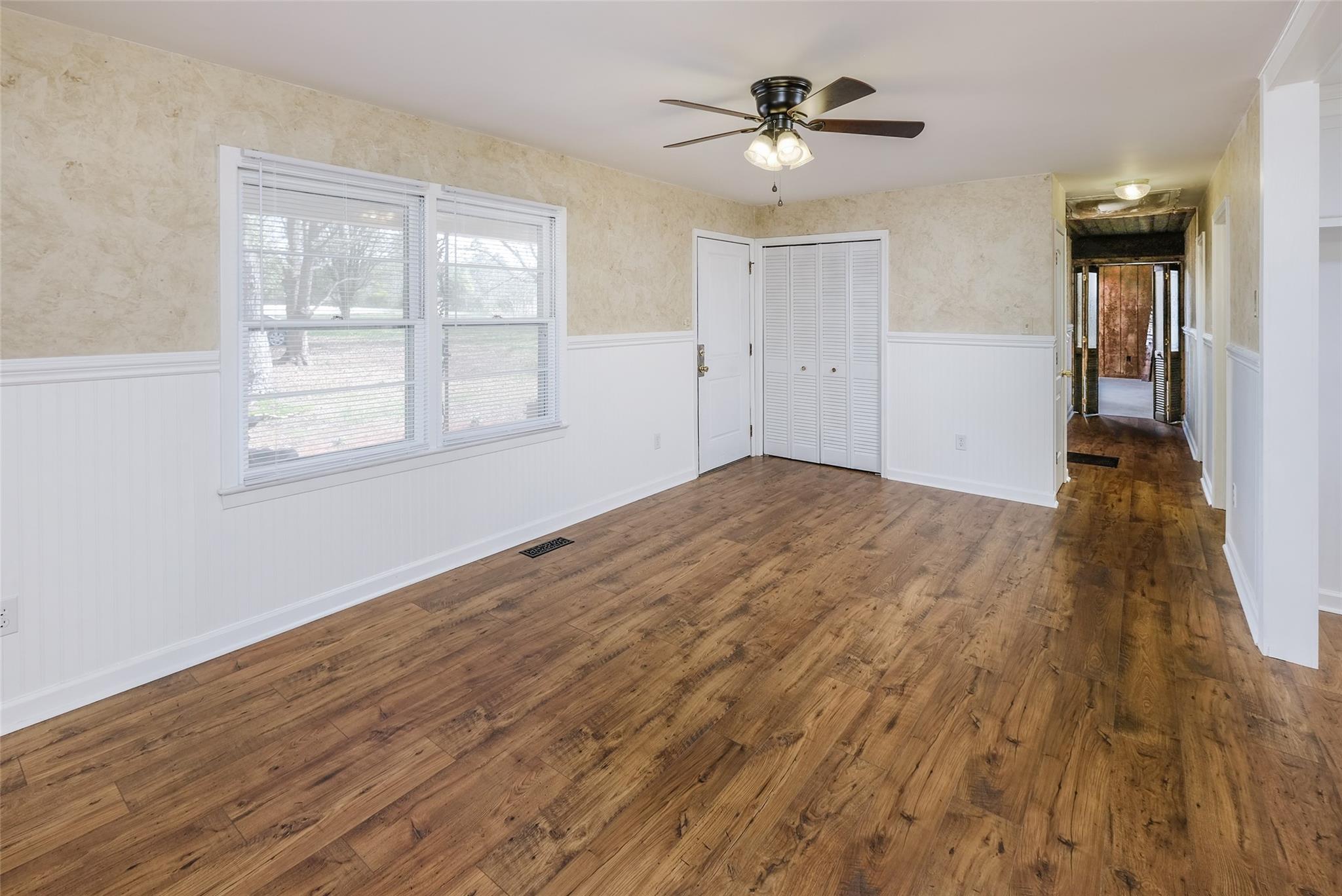 200 Johnson Dairy Road Rockwell, NC 28138 - Photo 5 of 36 a view of empty room with wooden floor and fan