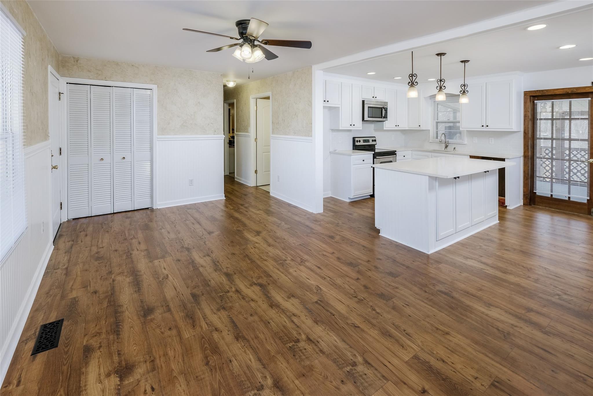200 Johnson Dairy Road Rockwell, NC 28138 - Photo 6 of 36 a view of kitchen with cabinets and wooden floor
