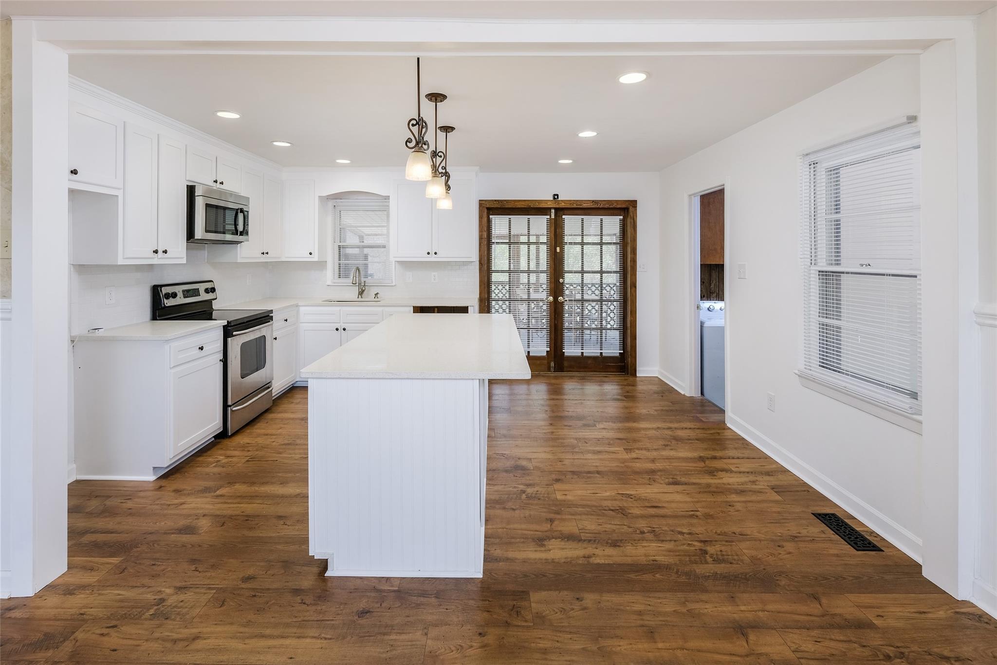 200 Johnson Dairy Road Rockwell, NC 28138 - Photo 7 of 36 a large kitchen with stainless steel appliances granite countertop a large counter top and a stove top oven
