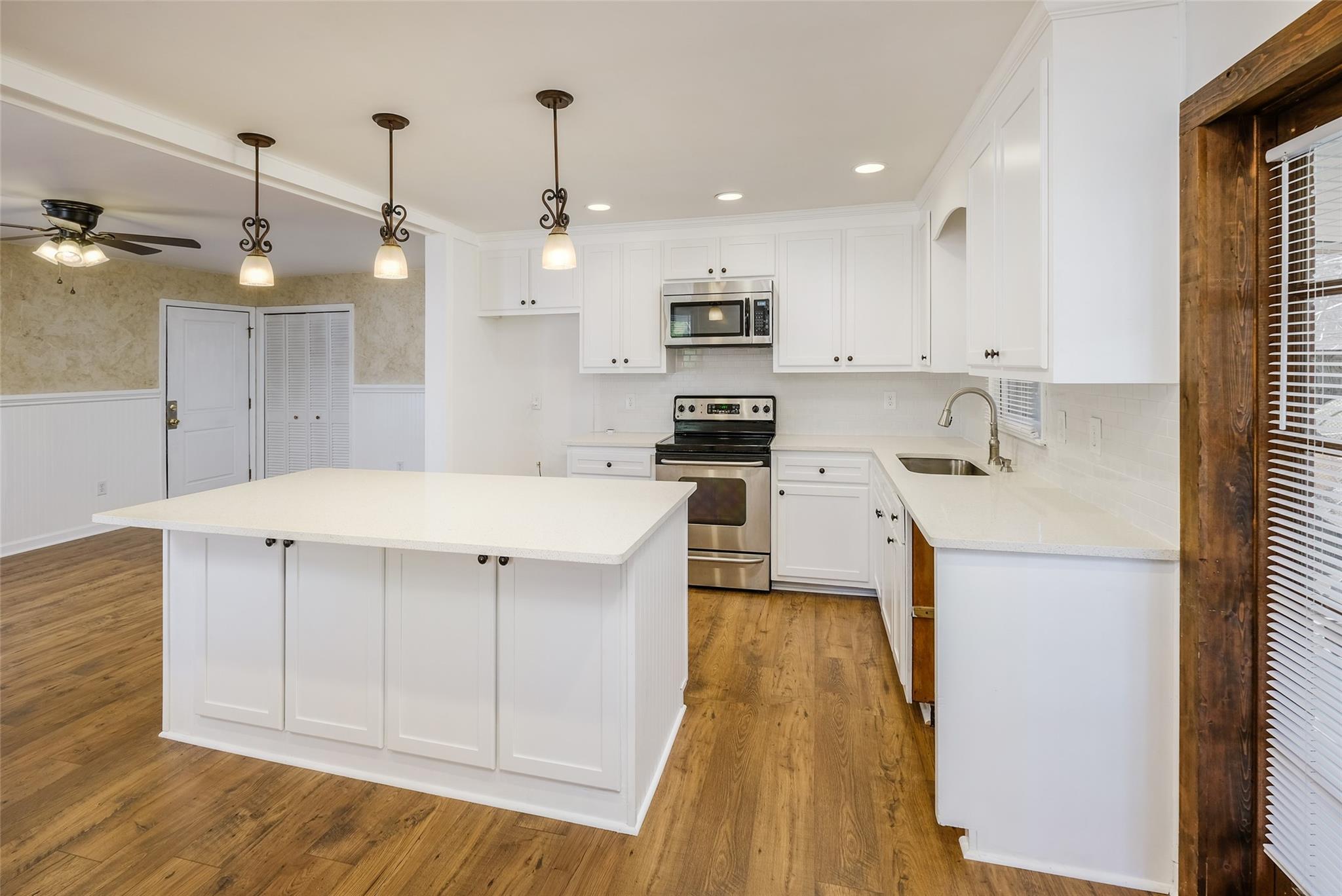 200 Johnson Dairy Road Rockwell, NC 28138 - Photo 8 of 36 a kitchen with a sink a counter space cabinets and appliances