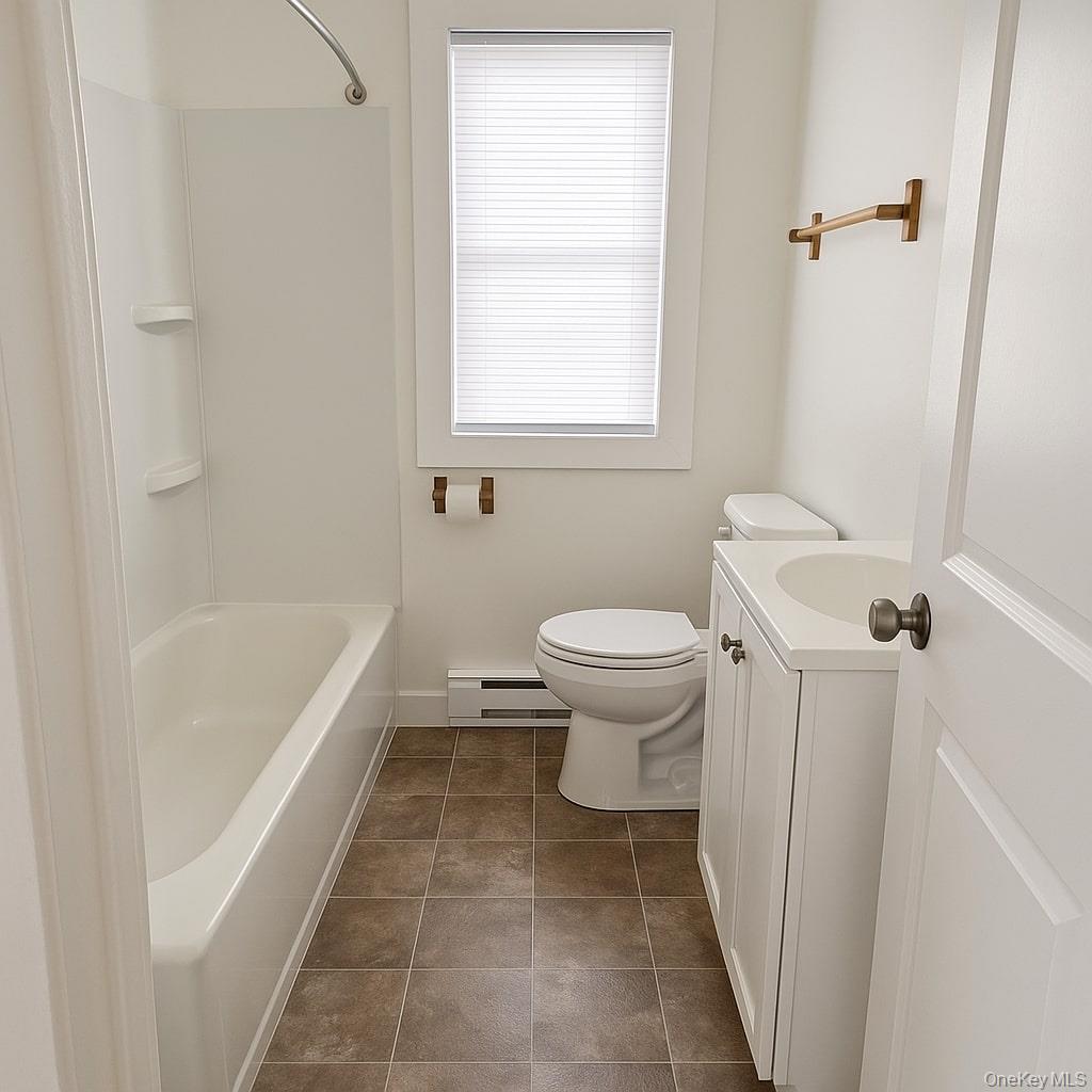 19 Old Greenfield Road, Unit 1 Ellenville, NY 12428 - Photo 6 of 6 a bathroom with a sink a toilet and bathtub