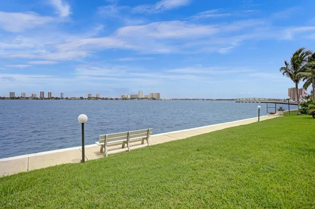 a view of a lake with table and chair