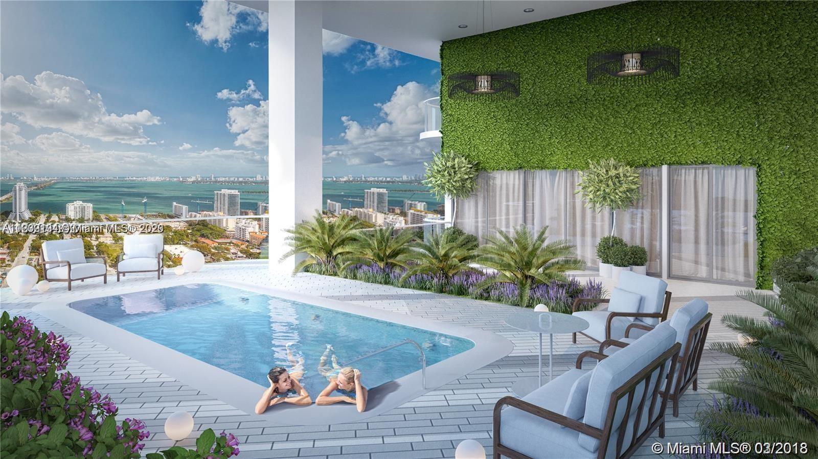 Midtown Miami Miami, FL 33137 - Photo 16 of 23 a view of a swimming pool with chairs