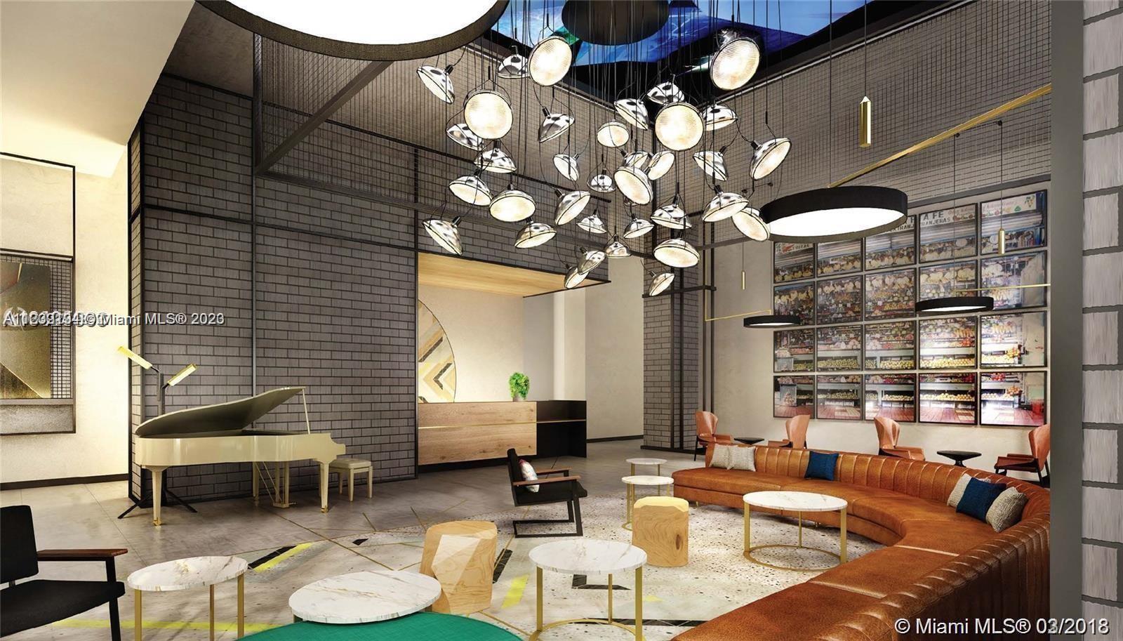 Midtown Miami Miami, FL 33137 - Photo 21 of 23 a living room with fireplace furniture and a large window