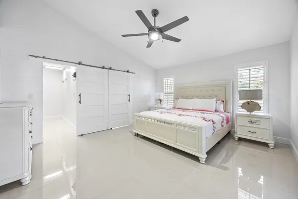 a spacious bathroom with a double vanity sink and a mirror