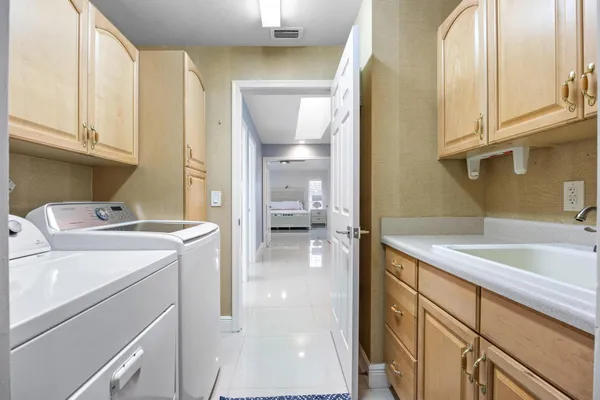 a living room filled with furniture and a potted plant