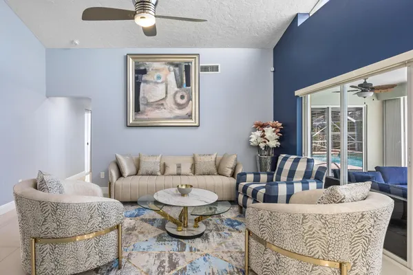 a living room with furniture and a large window