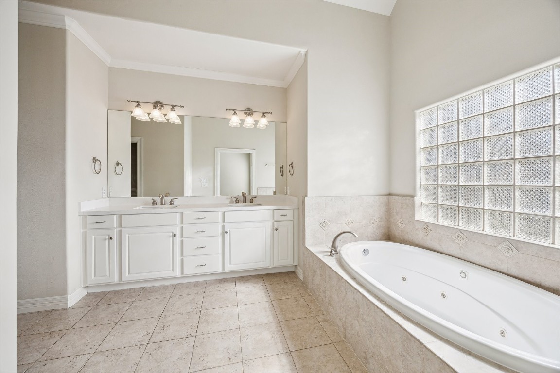 633 Hartman Street Houston, TX 77007 - Photo 14 of 23 a spacious bathroom with a granite countertop tub sink and mirror