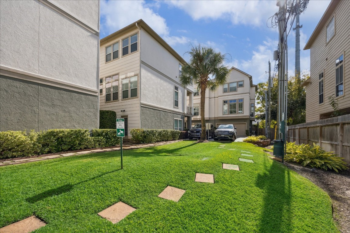 633 Hartman Street Houston, TX 77007 - Photo 23 of 23 a front view of a house with a yard