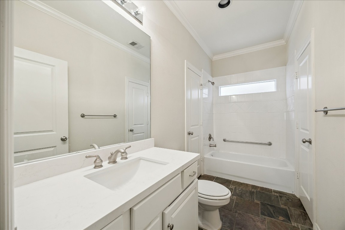 633 Hartman Street Houston, TX 77007 - Photo 5 of 23 a bathroom with a sink a toilet and shower