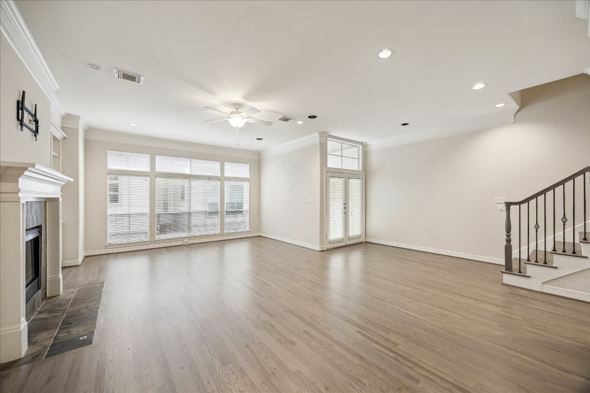 633 Hartman Street Houston, TX 77007 - Photo 8 of 23 a view of an empty room with wooden floor and a window