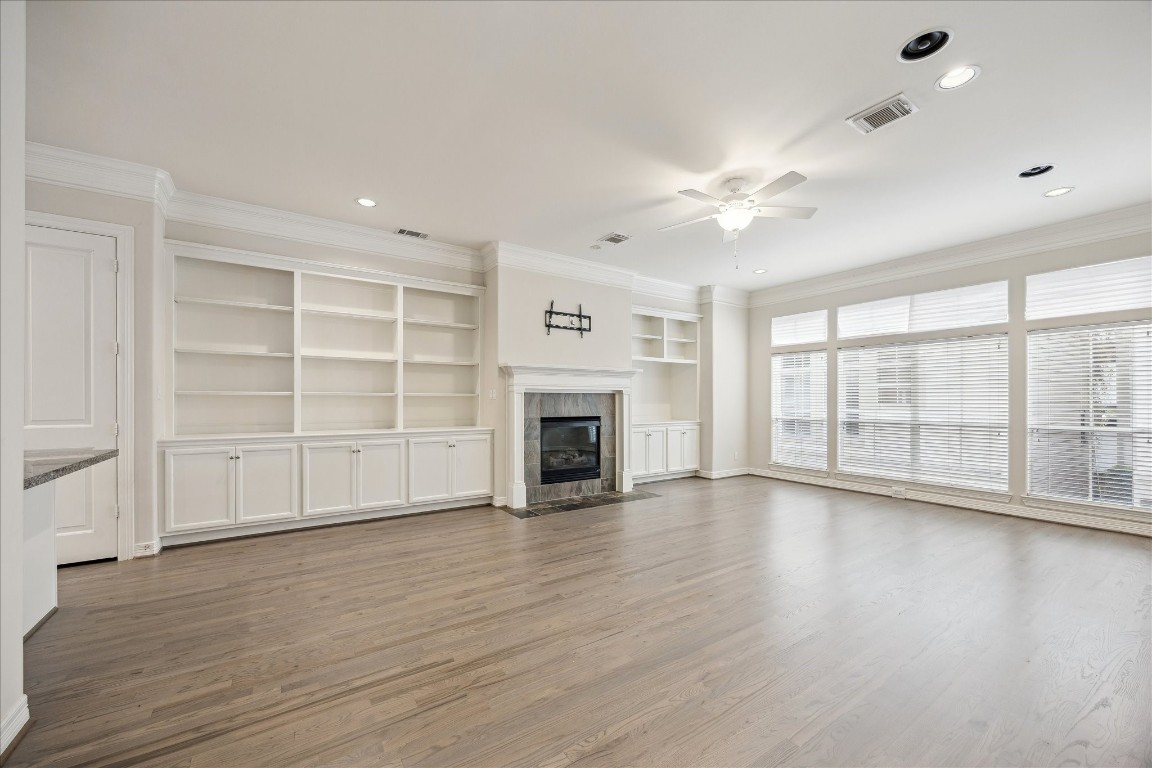 633 Hartman Street Houston, TX 77007 - Photo 9 of 23 a view of an empty room with a fireplace and a window