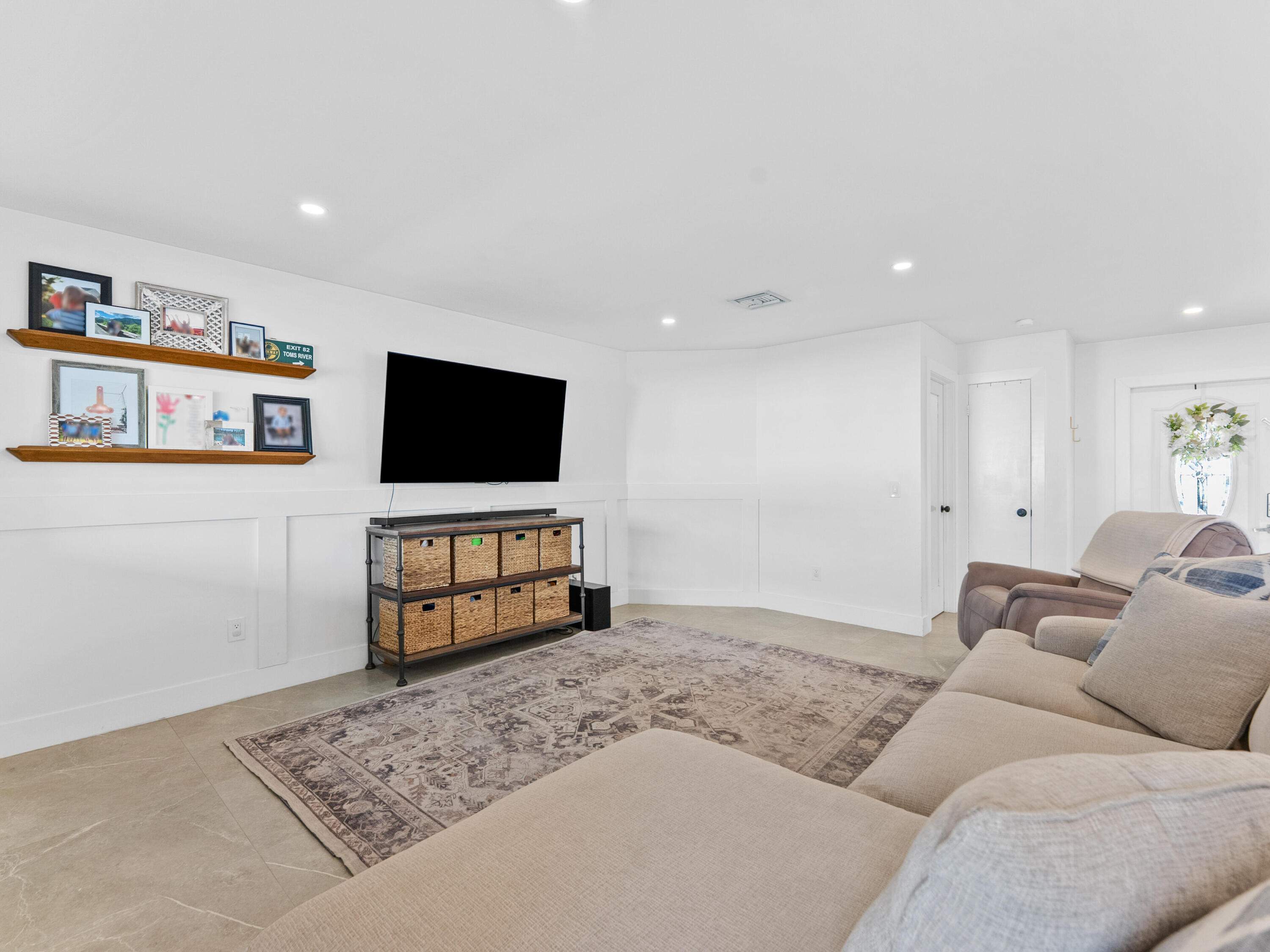 9329 Southwest 2nd Street Boca Raton, FL 33428 - Photo 13 of 42 a living room with furniture and a flat screen tv