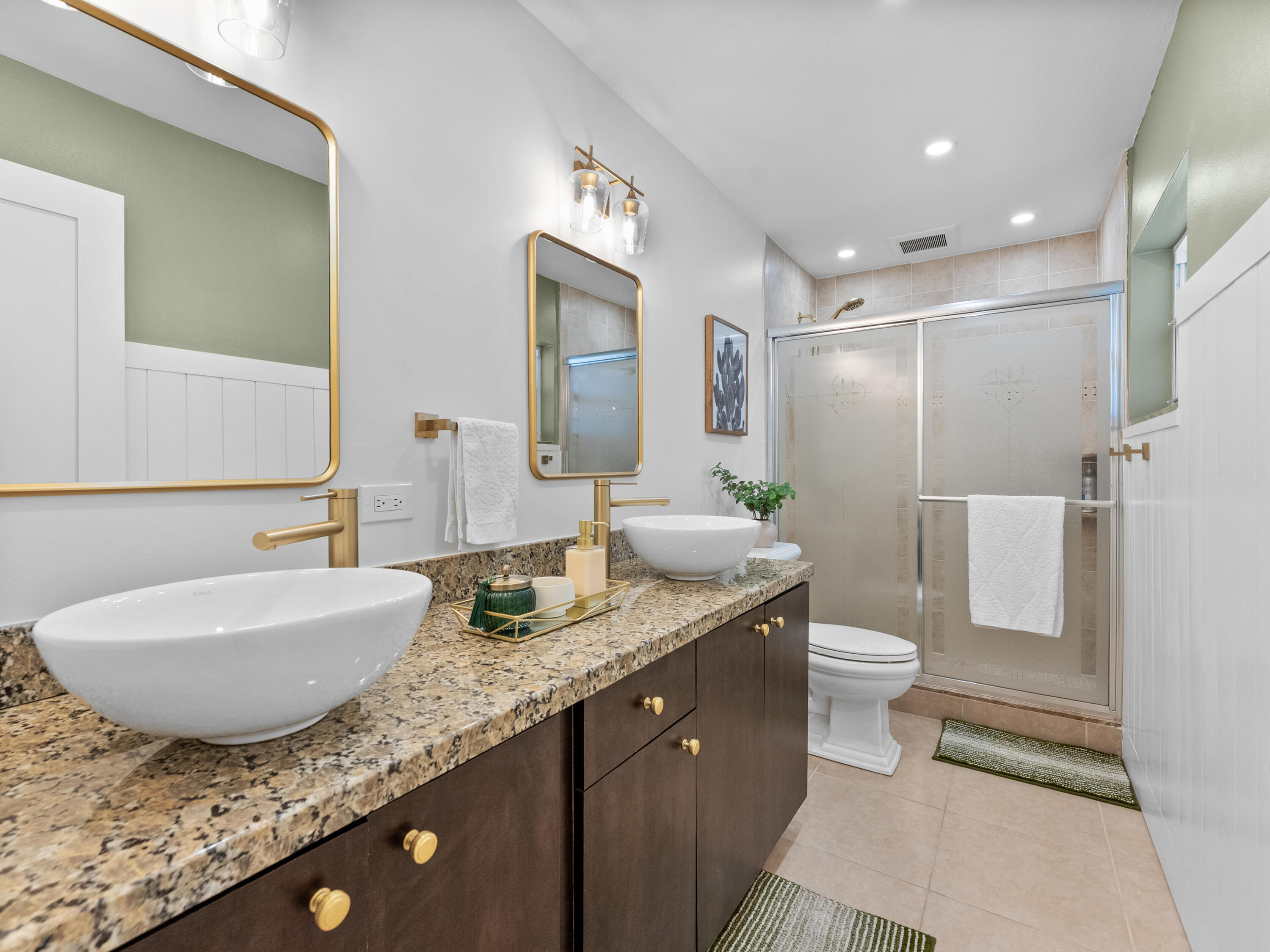 9329 Southwest 2nd Street Boca Raton, FL 33428 - Photo 17 of 42 a bathroom with a granite countertop sink and a mirror