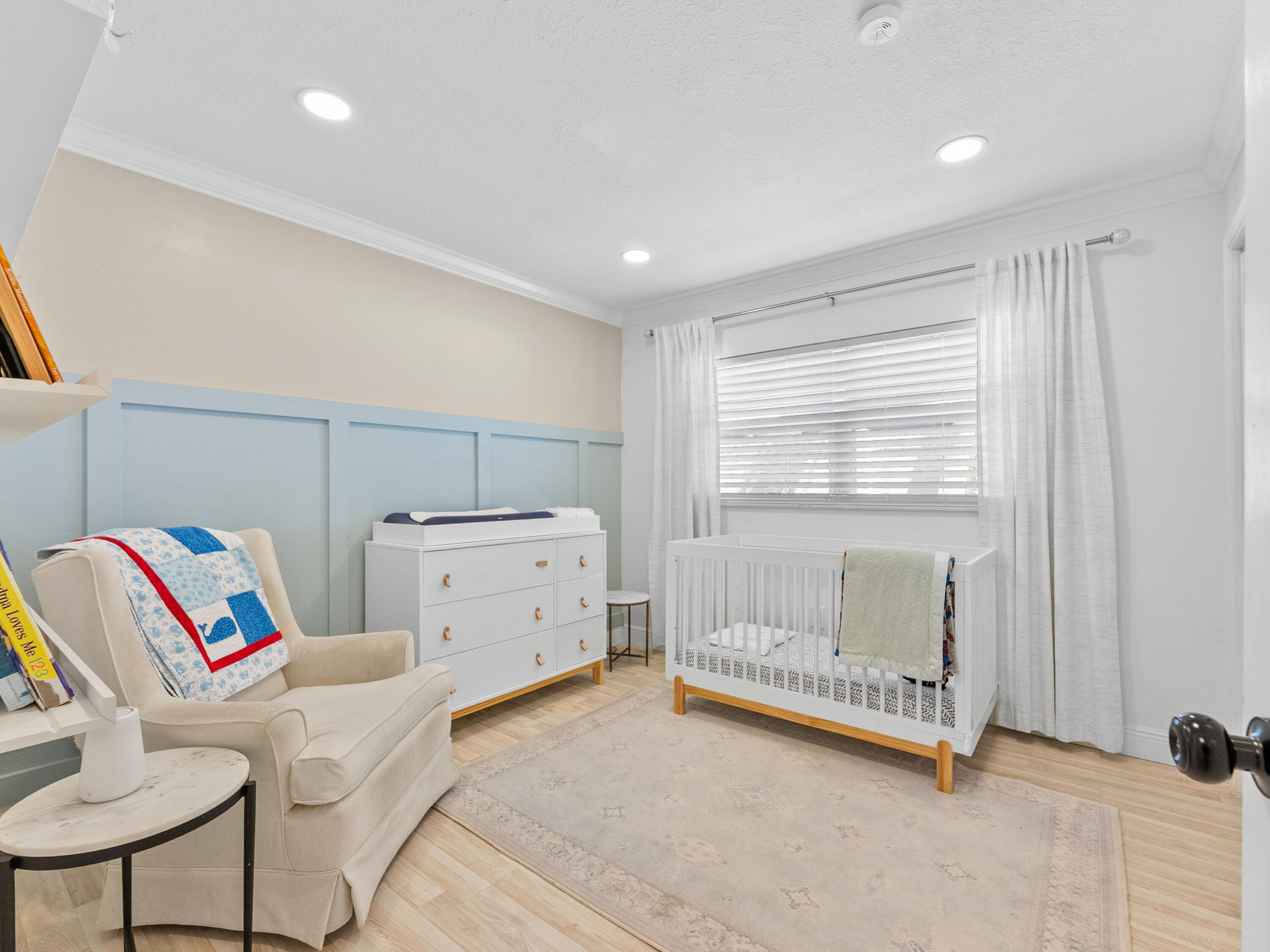 9329 Southwest 2nd Street Boca Raton, FL 33428 - Photo 20 of 42 a bedroom with a bed and a chair