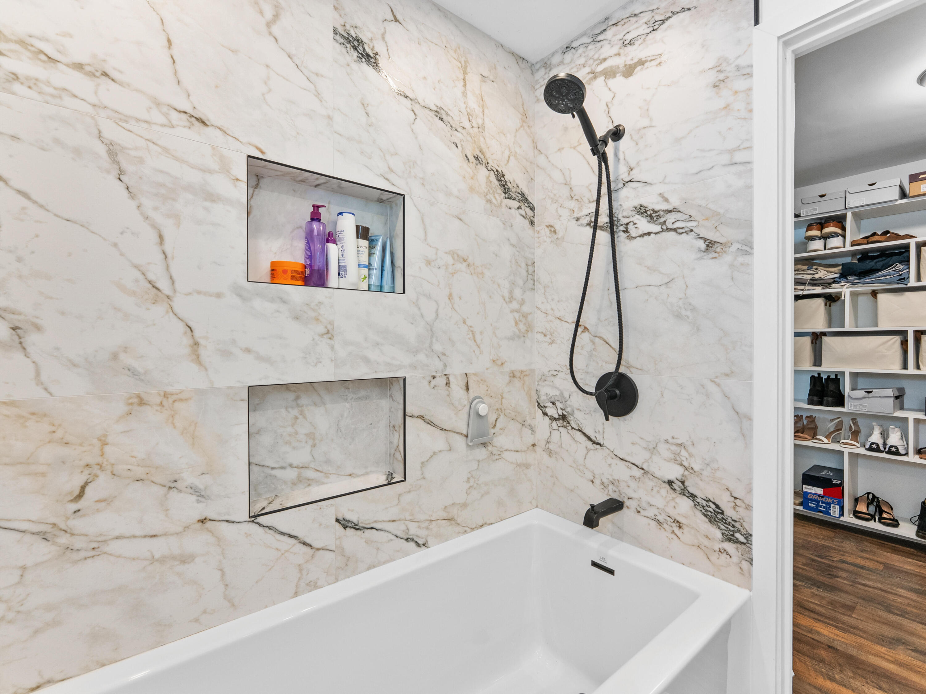 9329 Southwest 2nd Street Boca Raton, FL 33428 - Photo 25 of 42 a bathroom with a bath tub and a shower