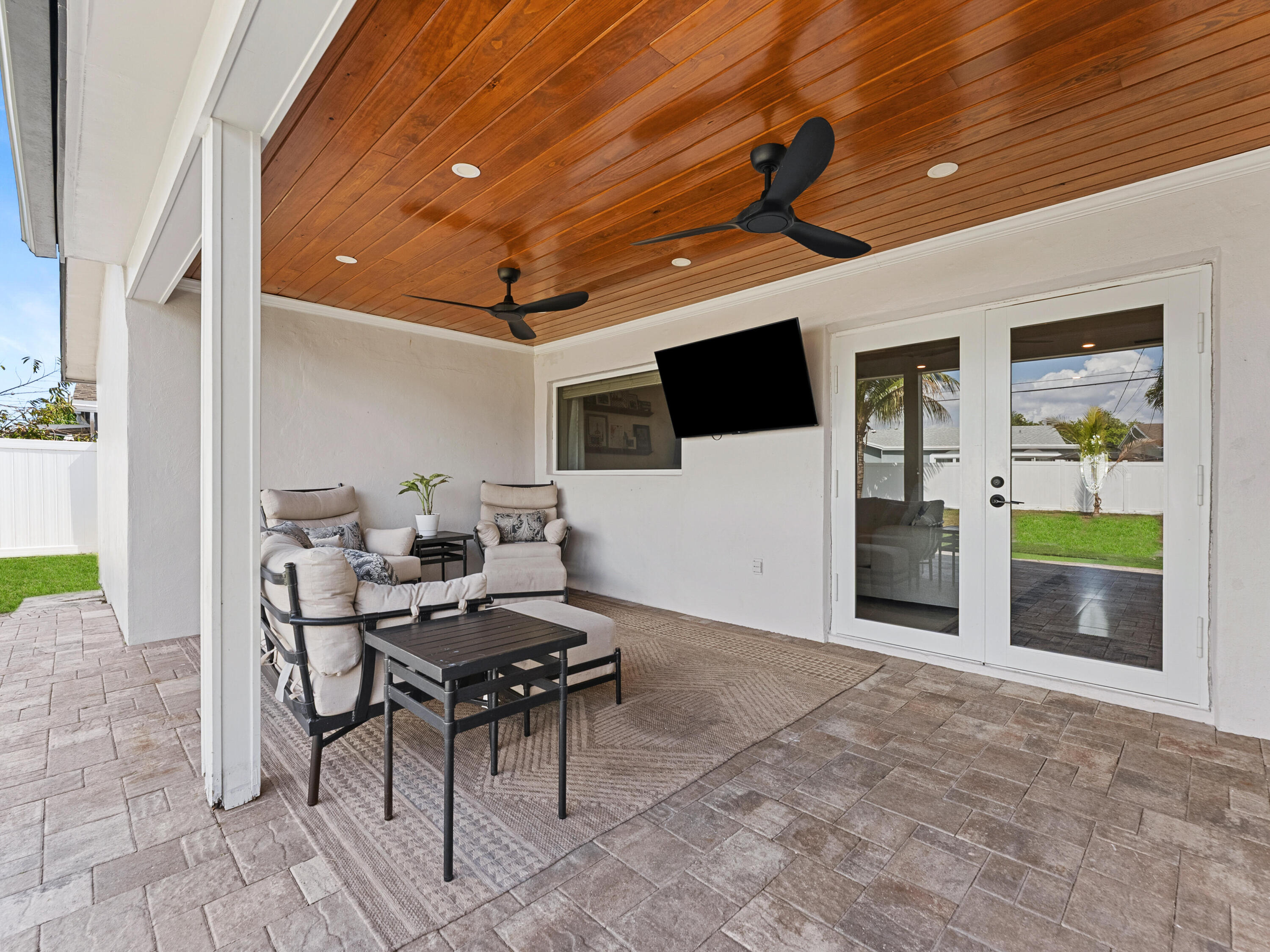 9329 Southwest 2nd Street Boca Raton, FL 33428 - Photo 27 of 42 a livingroom with furniture and a flat screen tv
