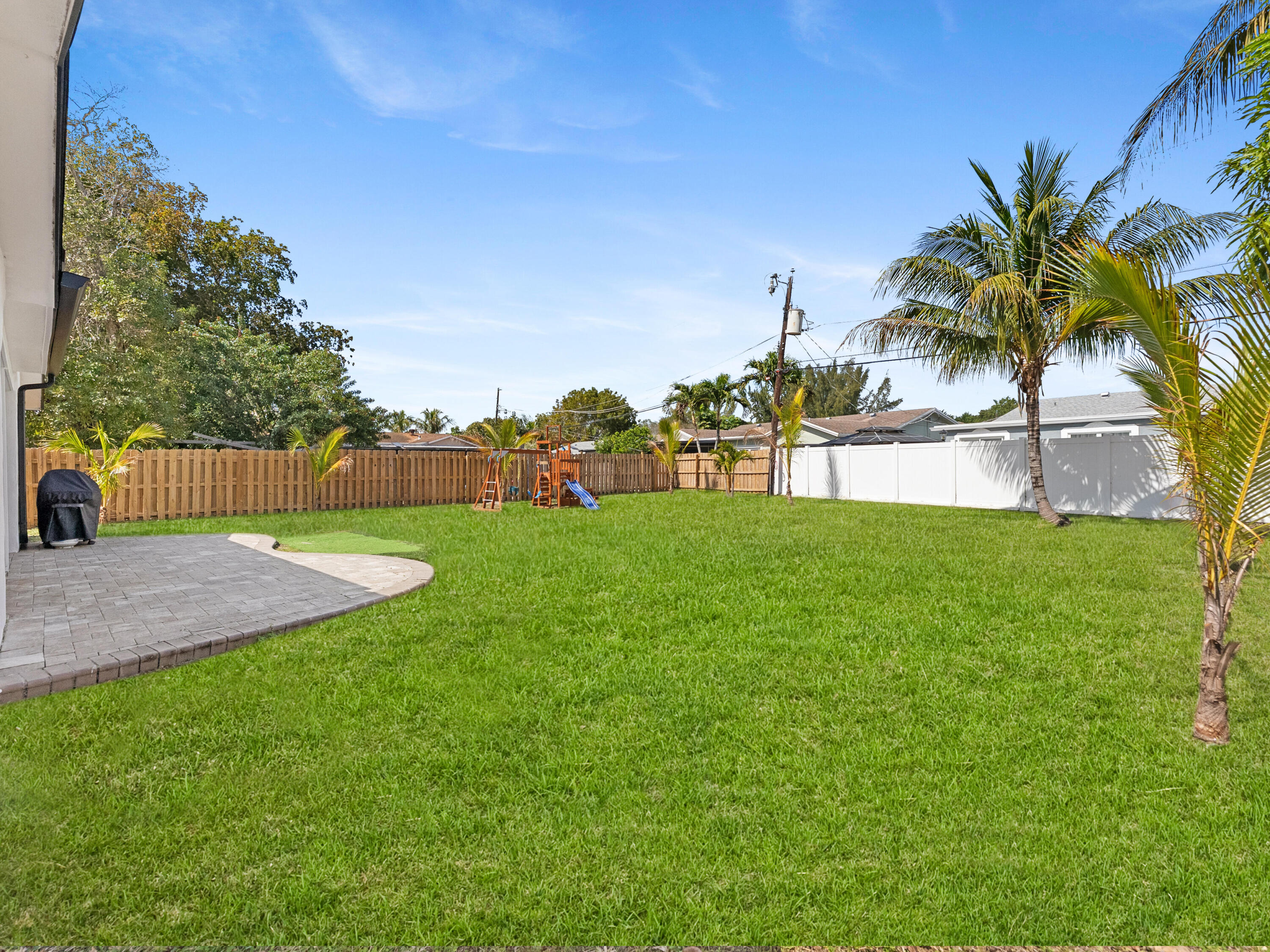 9329 Southwest 2nd Street Boca Raton, FL 33428 - Photo 30 of 42 a view of yard with swimming pool and green space