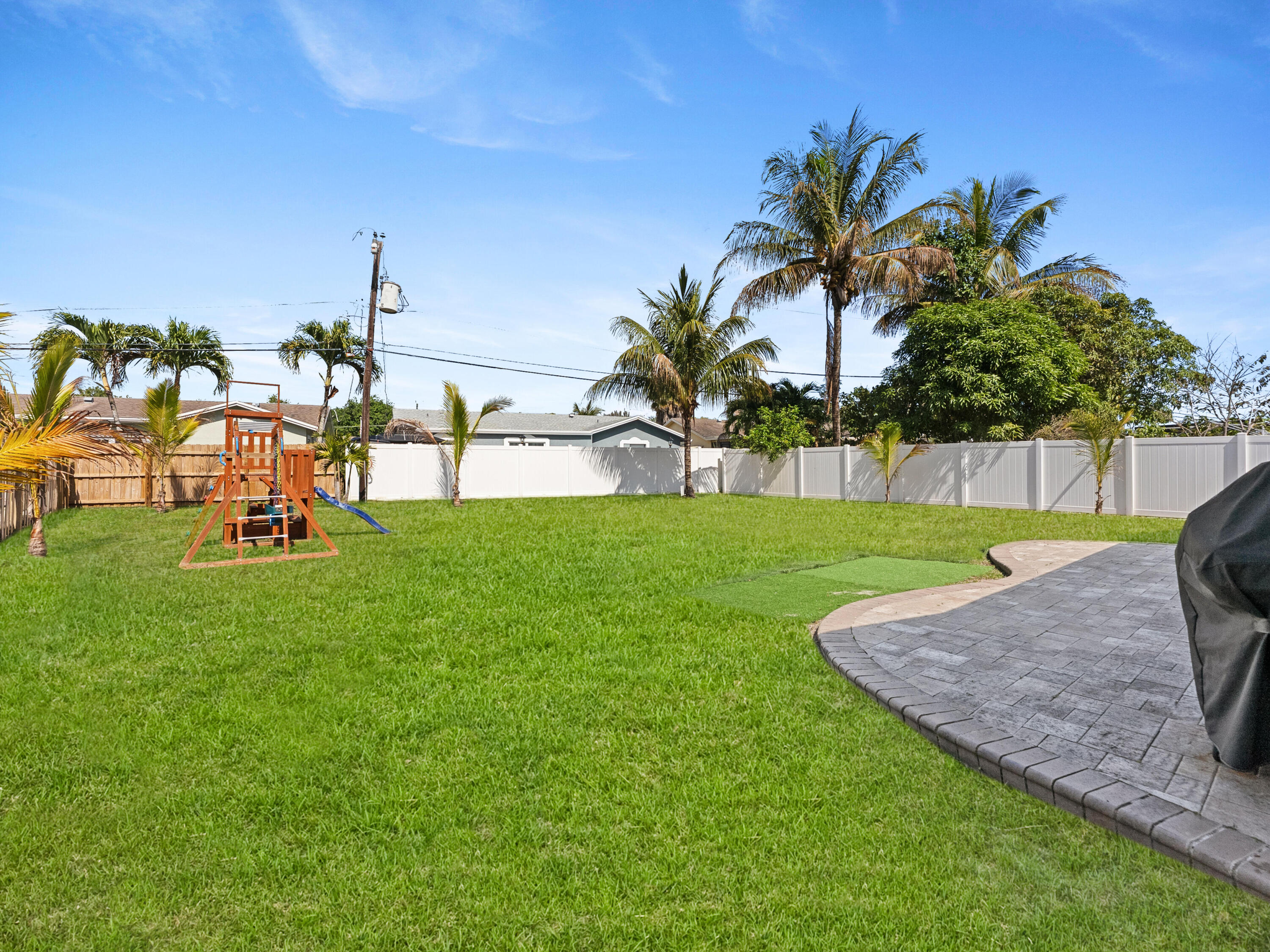 9329 Southwest 2nd Street Boca Raton, FL 33428 - Photo 31 of 42 a view of a backyard with a garden and plants