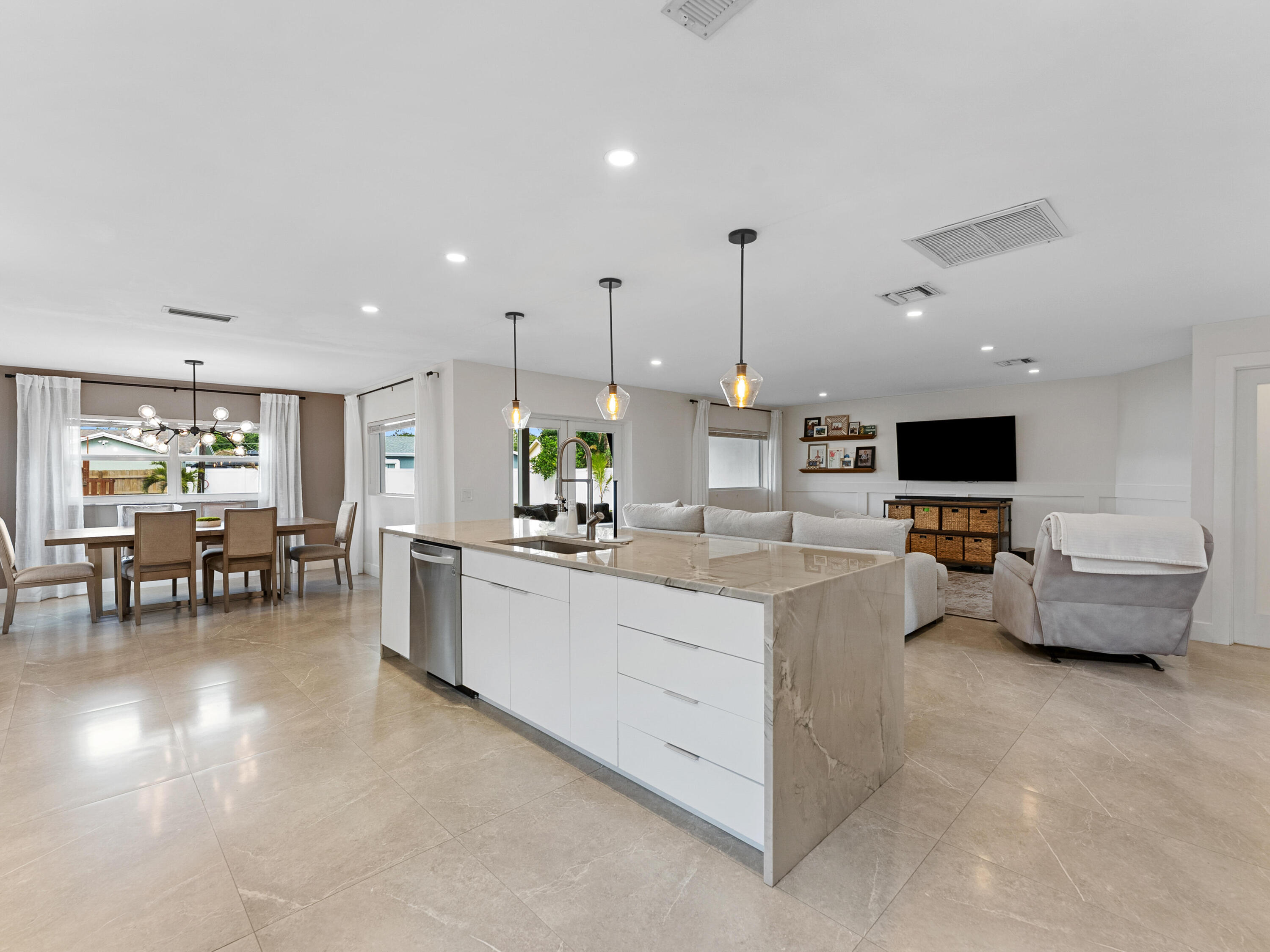 9329 Southwest 2nd Street Boca Raton, FL 33428 - Photo 7 of 42 a living room with furniture and a flat screen tv