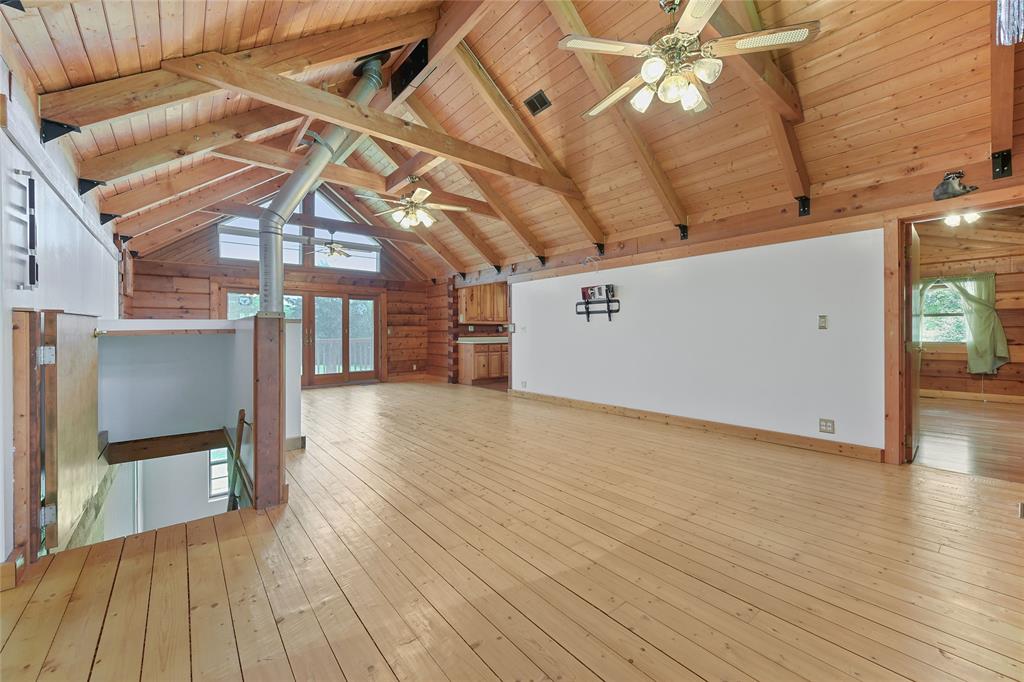 821 Ewing Road Ferris, TX 75125 - Photo 12 of 40 a view of a room with wooden floor