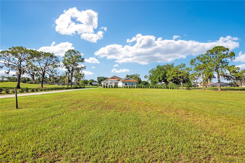 440 Palma Ceia Road Winter Haven, FL 33884 - Photo 61 of 78 a view of a field with an trees