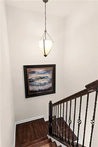 a view of a room with wooden floor and window