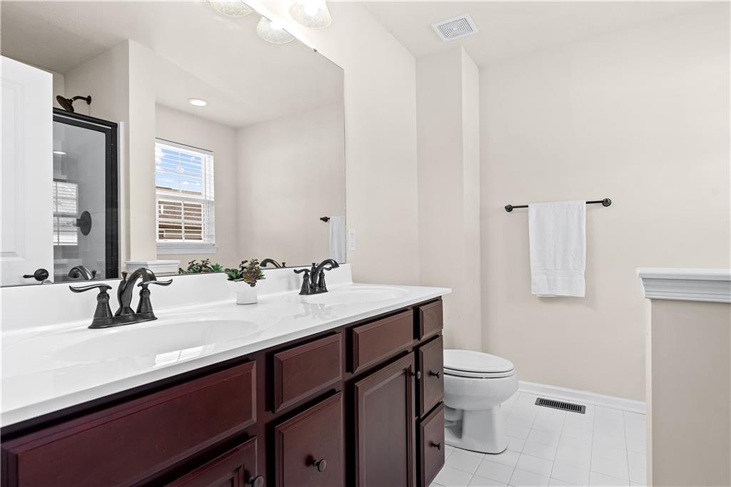 1703 Pointe View Drive Mars, PA 16046 - Photo 14 of 21 a bathroom with a sink a toilet a mirror and shower