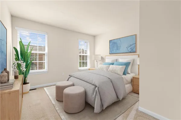 a bedroom with a bed and a couch