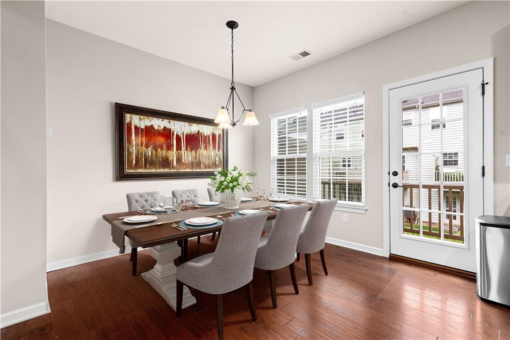 1703 Pointe View Drive Mars, PA 16046 - Photo 5 of 21 a dining room with furniture a chandelier and wooden floor
