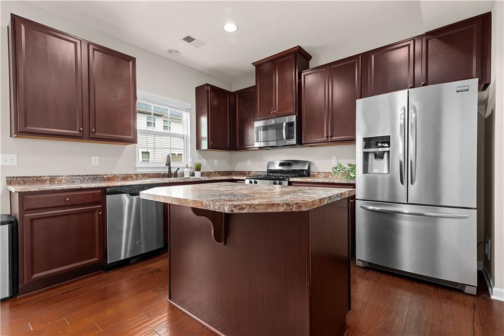 1703 Pointe View Drive Mars, PA 16046 - Photo 7 of 21 a kitchen with stainless steel appliances granite countertop a refrigerator stove a sink and a oven