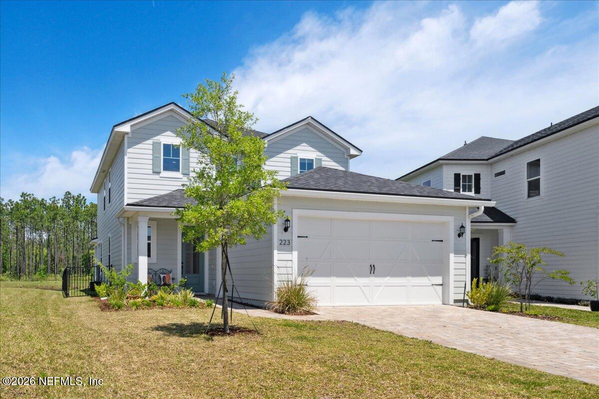 223 Tanner Trail St. Augustine, FL 32092 - Photo 1 of 44 a front view of a house with garden