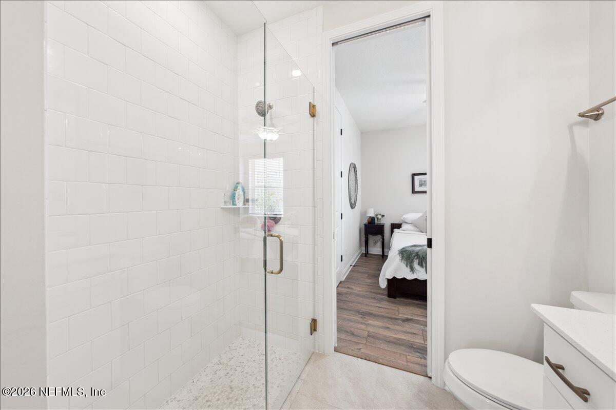 223 Tanner Trail St. Augustine, FL 32092 - Photo 12 of 44 a bathroom with a shower and toilet