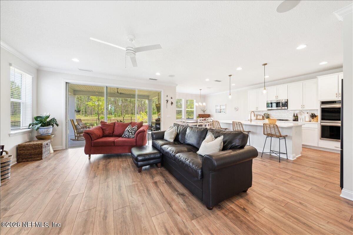 223 Tanner Trail St. Augustine, FL 32092 - Photo 13 of 44 a living room with furniture and a wooden floor