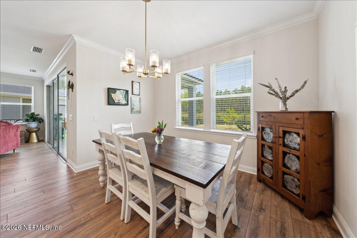 223 Tanner Trail St. Augustine, FL 32092 - Photo 14 of 44 a view of a dining room with furniture window and wooden floor