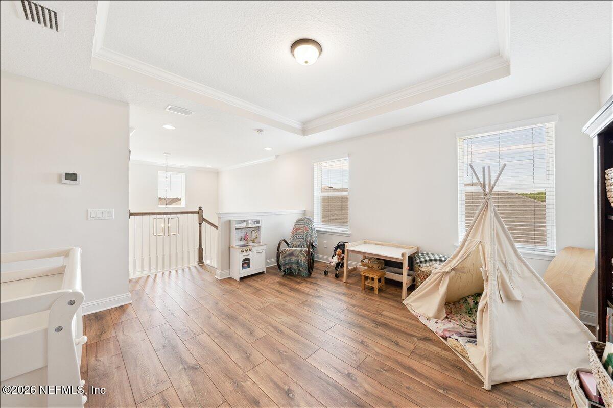223 Tanner Trail St. Augustine, FL 32092 - Photo 20 of 44 a living room with furniture and a wooden floor