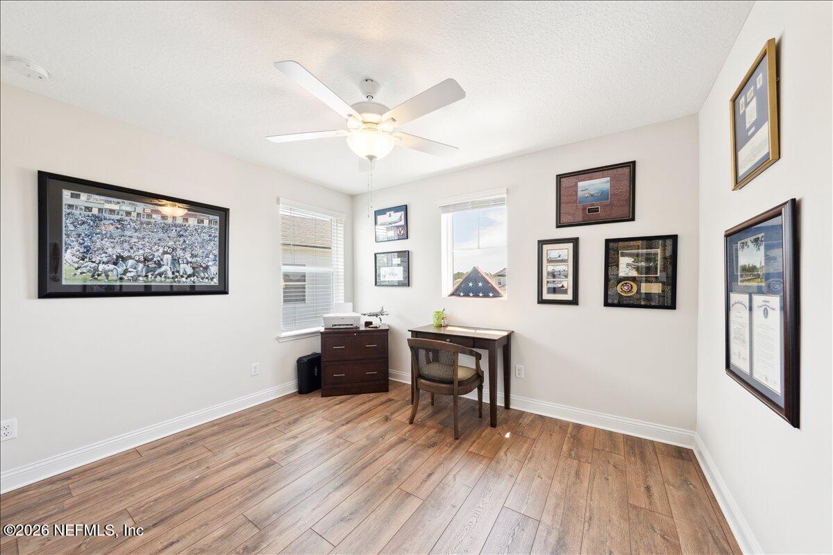 223 Tanner Trail St. Augustine, FL 32092 - Photo 22 of 44 a view of workspace with wooden floor and windows