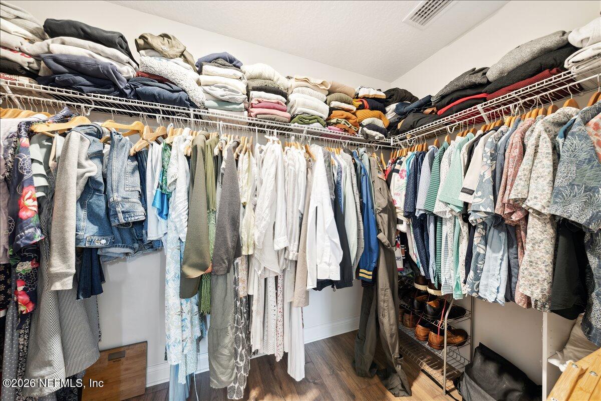 223 Tanner Trail St. Augustine, FL 32092 - Photo 29 of 44 a view of walk in closet with clothes and shoes