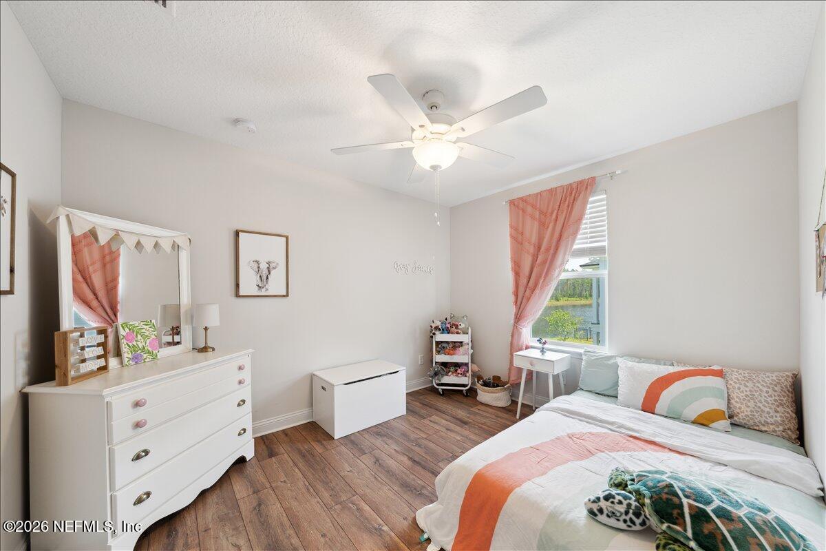 223 Tanner Trail St. Augustine, FL 32092 - Photo 30 of 44 a bedroom with two beds and a large window