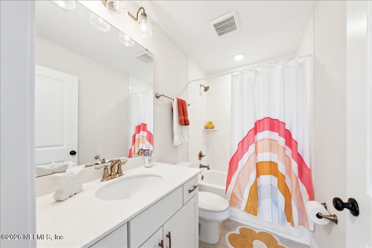 223 Tanner Trail St. Augustine, FL 32092 - Photo 31 of 44 a bathroom with a sink vanity mirror and toilet