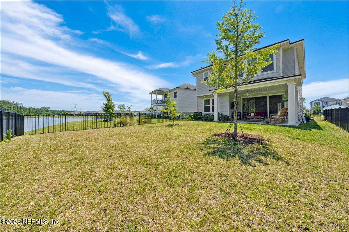 223 Tanner Trail St. Augustine, FL 32092 - Photo 38 of 44 a view of a house with swimming pool and yard